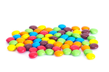 A colorful assortment of shiny round gumballs.