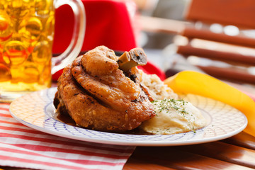 eisbein with braised cabbage, potato and beer