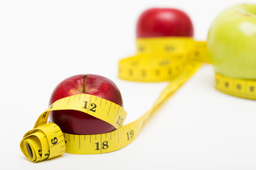 red apple and measuring tape