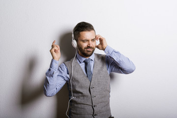 Hipster businessman with headphones