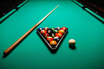 Billiard balls in a pool table.
