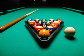 Billiard balls in a pool table. - obrazy, fototapety, plakaty