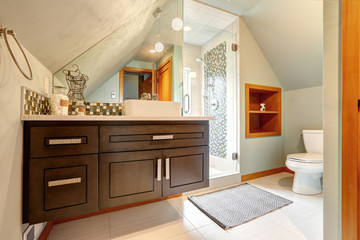 Bathroom with vautled ceiling and glass door shower