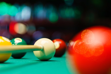 Billiard balls in a pool table.