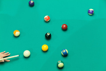 Breaking Pool Balls on green table