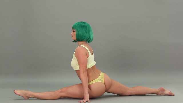 flexible woman in underwear doing split