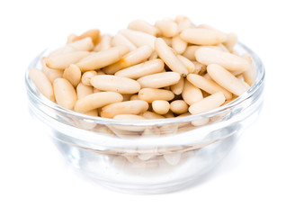 Heap of fresh Pine Nuts over white