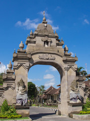 Fototapeta na wymiar City gate with figures of security guards. Bali, Indonesia