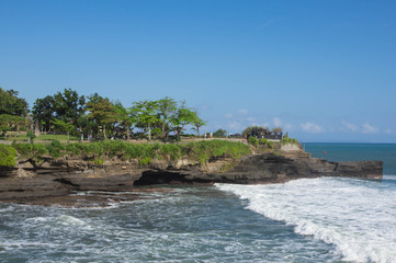 The ancient temple on the coast of the ocean. Bali, Indonesia