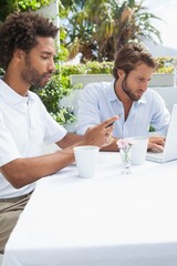 Two busy friends having coffee together