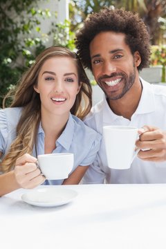 Happy couple having coffee together