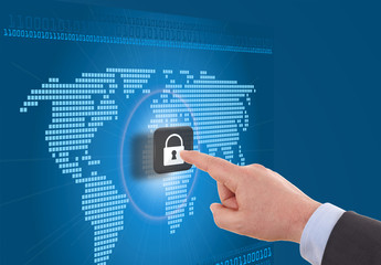 Businessman selecting a padlock with world map on the background