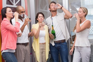 Team of business people drinking champagne