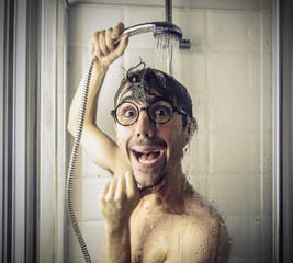 Surprised man under the shower - obrazy, fototapety, plakaty