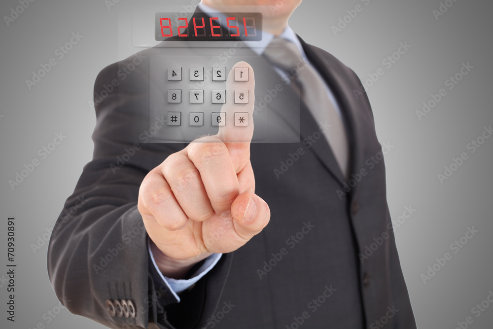 Poster businessman is setting code of security alarm system