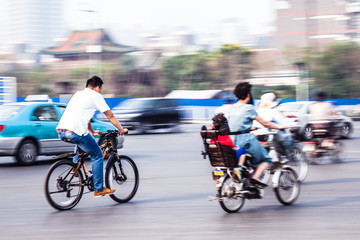 bicycle riders in the city in motion blur