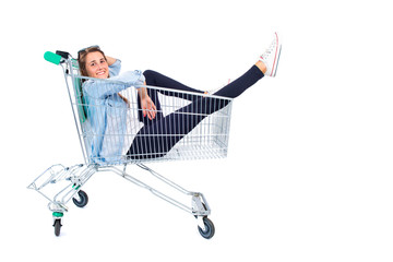 Blonde pretty girl inside supermarket cart © luismolinero