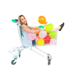 Blonde pretty girl inside supermarket cart