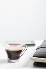 Coffee cup and mobile phone