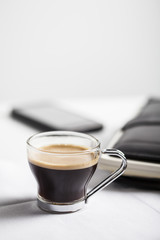 Coffee cup and mobile phone