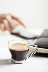 Coffee cup and mobile phone