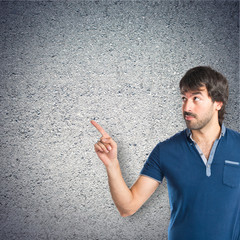 Man thinking over textured background