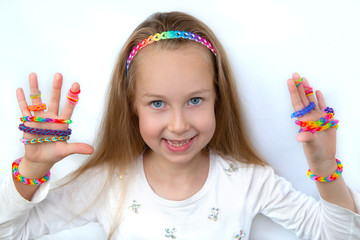 Little girl demonstrating her cruft works, Loom bangs