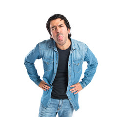 Fototapeta premium Man doing a joke over isolated white background