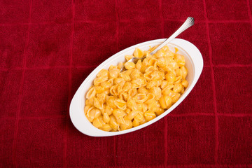 Shells and Cheese in White Dish on Red Towel