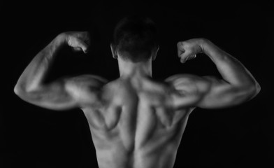 Fototapeta na wymiar Sexy muscular man on dark background