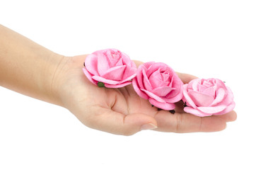 Artificial pink rose in hand