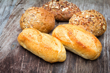 bread and rolls on wood