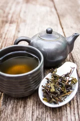 Foto op Aluminium cup of tea and teapot, old wooden desk © wanchai
