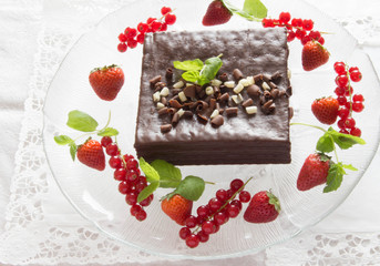 Chocolate cake with fresh berries, selective focus
