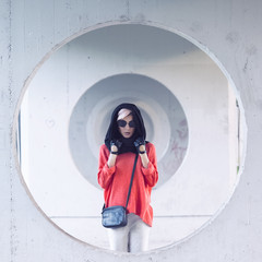 Fashion girl portrait in a stylish black headscarf and sunglasse