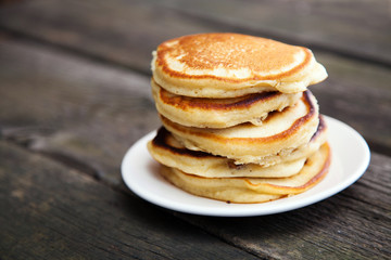 Delicious pancakes on a wooden table - obrazy, fototapety, plakaty
