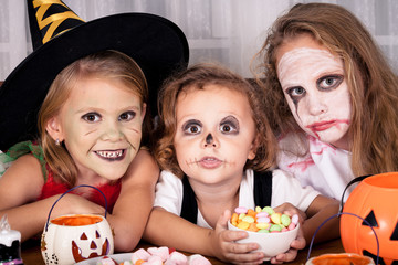 brother and two sisters on  Halloween party