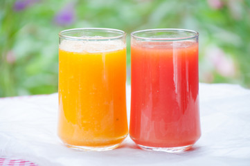 Papaya juice in glass on table