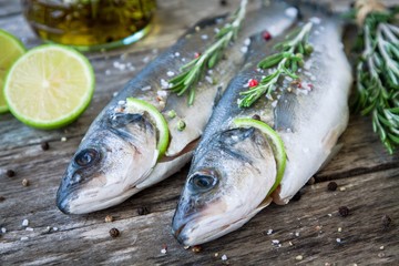 Two raw seabass with lime and rosemary