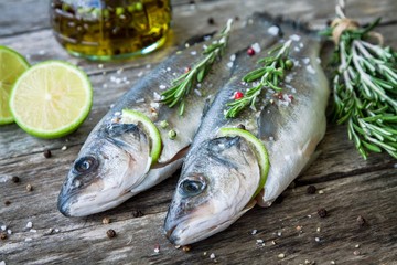Two raw seabass with lime and rosemary