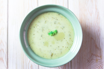 Broccoli cream soup on table