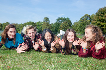 Group of young people lying in the park