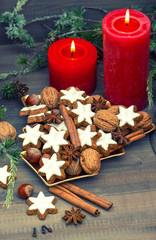 cinnamon cookies, nuts and spices with christmas decoration
