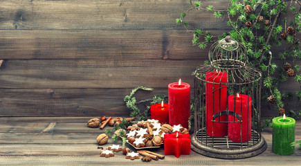 christmas decoration with red candles and cinnamon cookies