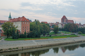 Naklejka na ściany i meble Early morning in Old Town of Torun, Poland. Vistula river
