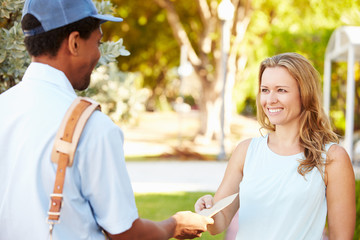 Mailman Delivering Letters To Woman - obrazy, fototapety, plakaty