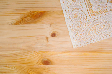 delicate white cloth on a wooden board
