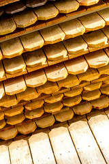 Stacked unpainted wood picket fence lumber