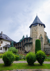 Fototapeta na wymiar Old tower at Putna Monastery in Moldavia region of Romania