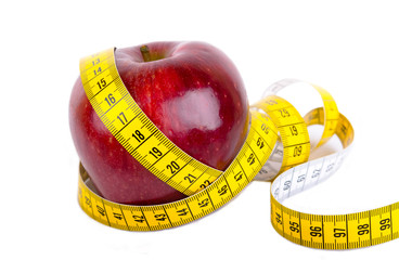 Measuring tape wrapped around a apple weight loss photo